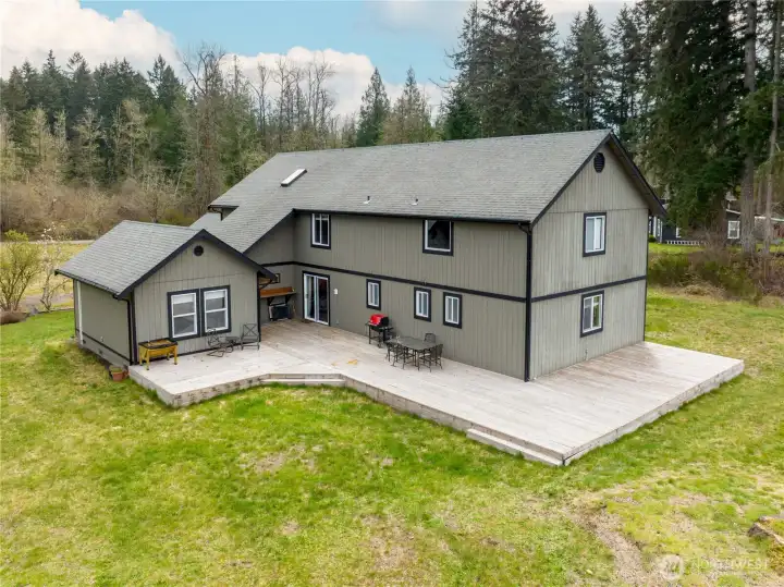 Enjoy the ultimate outdoor retreat on this oversized deck, overlooking a level backyard with endless potential and plenty of room for activities