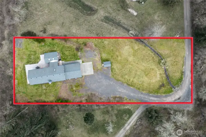 Expansive 1+ acre grounds; a peaceful, private sanctuary with plenty of room for RV parking, recreation, and enjoying the quiet surroundings. Approximate property lines shown.