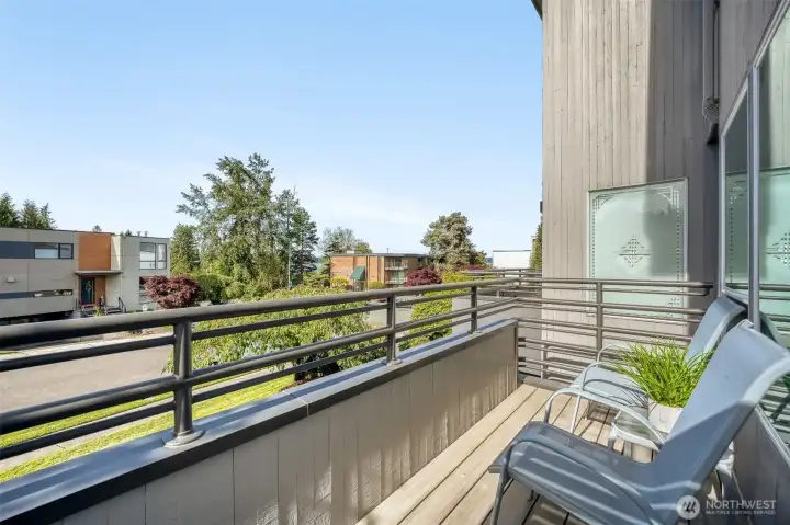 Deck off the living room offers fresh Northwest air and neighborhood charm.