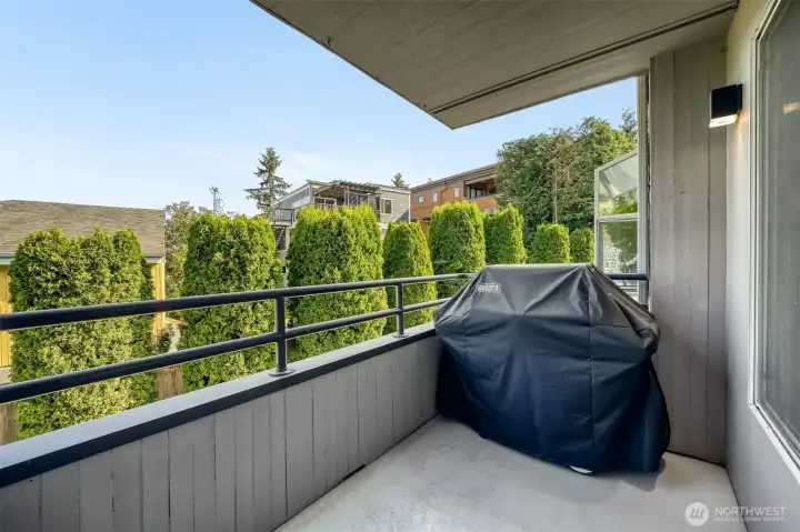 Covered deck access extends the kitchen outdoors.