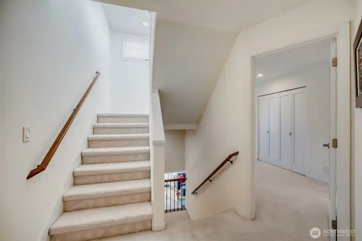 3rd level to bedrooms. Stairs up lead to rooftop deck.