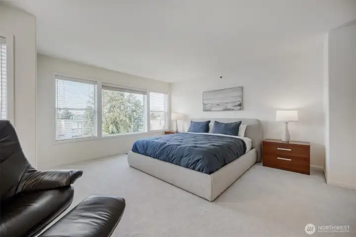 Spacious primary suite filled with natural light.