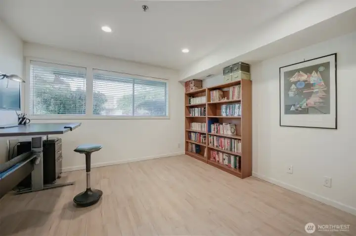 Versatile lower-level room ideal as a bedroom, office, or den.