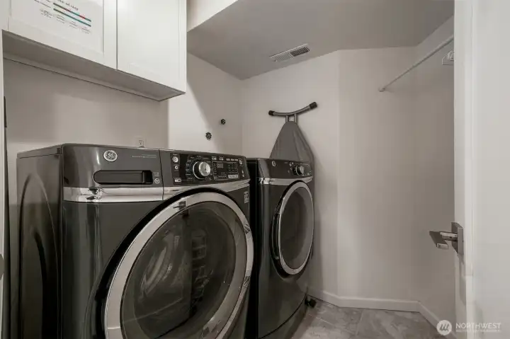 Walk-in laundry room with high-end GE appliances included.