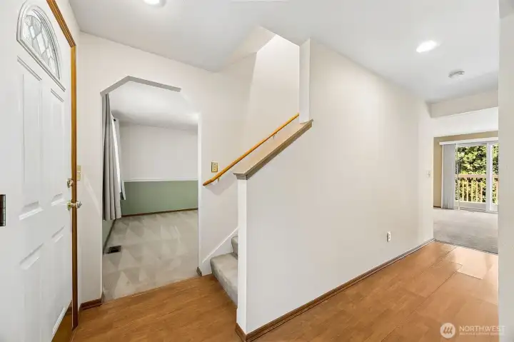 Welcoming entry leads formal living and dining spaces, while the hall guides you effortlessly to the inviting family room, creating a natural flow ideal for both everyday living and entertaining.