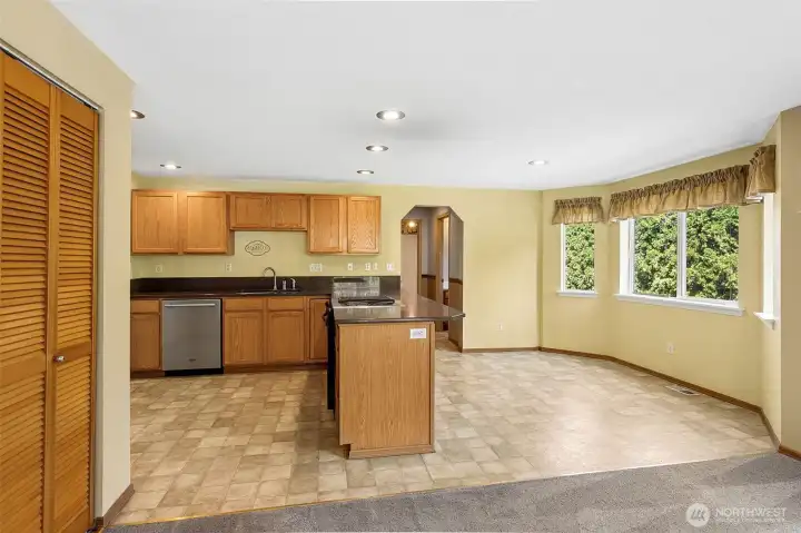 Bright breakfast nook offers a cozy spot for casual dining, perfectly positioned to enjoy morning light and easy access to the kitchen.