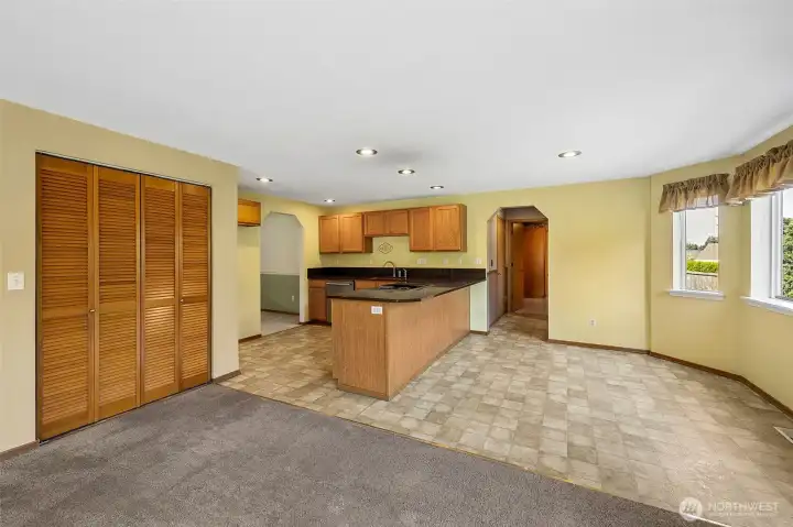Kitchen opens nicely to the breakfast nook + family room- offering a walk-in pantry just behind the bi-fold doors.