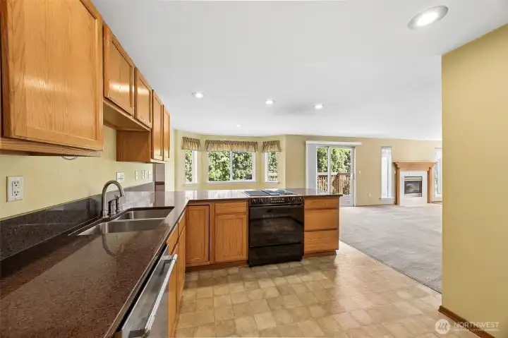 NEWER quartz countertops offers plenty of room for prep.