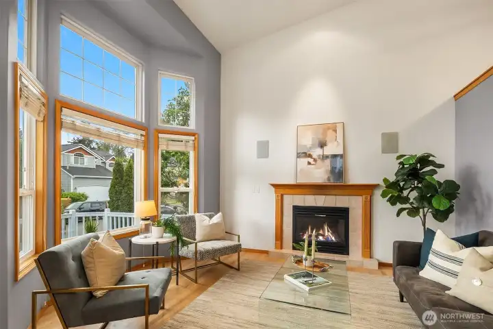 Soaring ceilings and hardwood floors greet you in this light filled home!