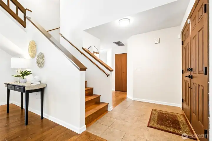 The bright, open foyer provides a comfortable arrival space with easy flow to the home's main living areas.