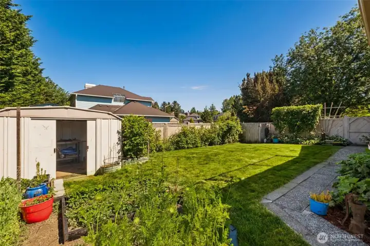 A gardener's delight! Enjoy a productive hobby garden, spacious lawn, and garden shed, all tucked within the privacy of a fully fenced back & side yard.
