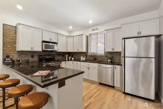 Granite tile counters and stainless appliances.