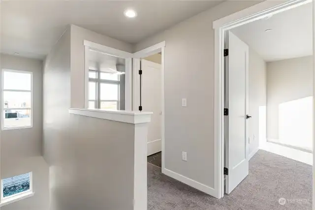 Doors on left & right are bedrooms, door in the middle is the bathroom