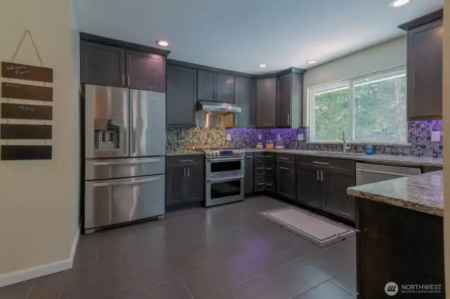 Updated kitchen with granite counters and all appliances stay.