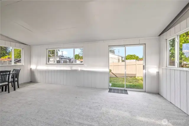 Covered Patio Space with Finished Carpet, great for entertaining guests and throwing parties.