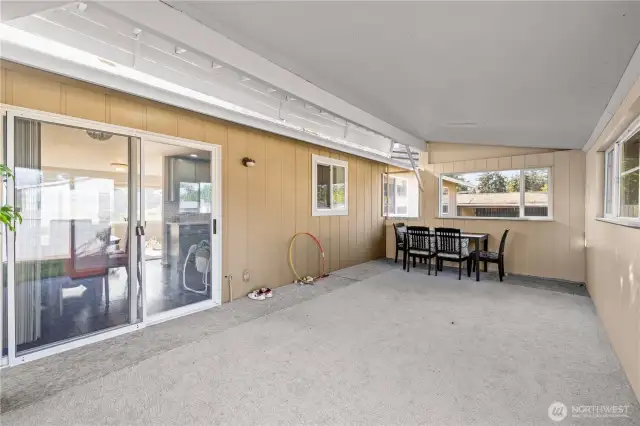 Covered Patio Space with Finished Carpet, great for entertaining guests and throwing parties.