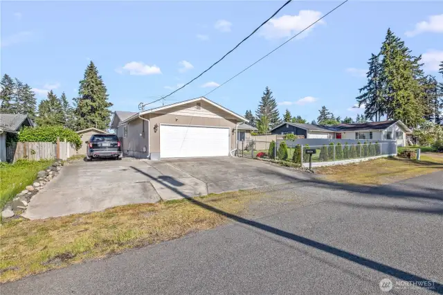 Side access for Boat, or RV Parking, with Shed style storage located near by. Also easy access to garage and driveway.