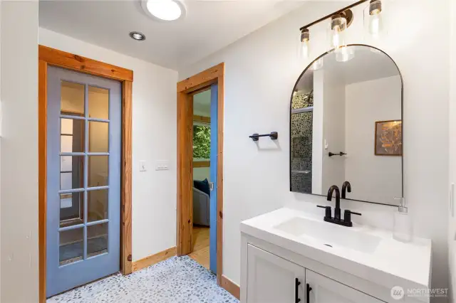 Another view of the primary bath with blue door leading to closet!