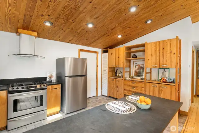 Plenty of storage AND NEW refrigerator, NEW dishwasher and a gas range! Door leads to garage.