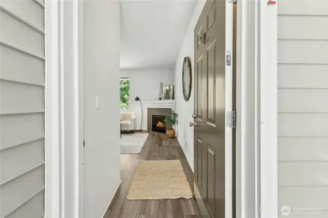 Enter into your unit with vinyl plank flooring.