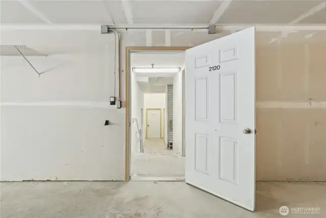 Door from garage to stairwell for unit.
