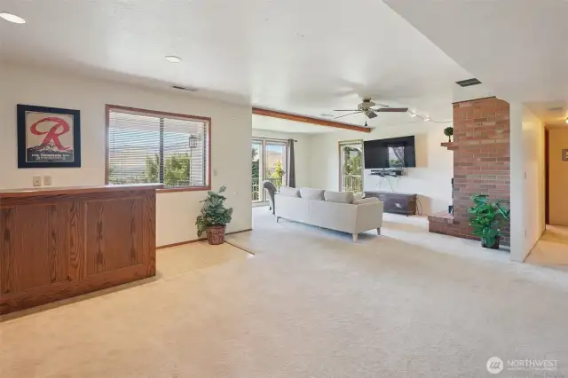 lower level family room, with fireplace and wet bar