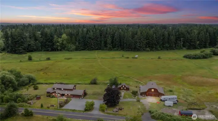 Experience peaceful country living with breathtaking views from this custom home overlooking 36 majestic acres.