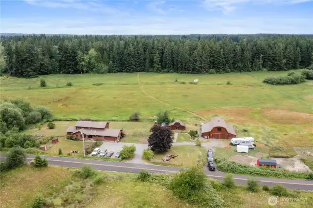 The property showcases 2 barns and 36 spectacular acres making room to live, work, and play!