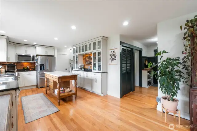 Enjoy a bright, airy kitchen with recessed lighting and white soft-close cabinetry with crown molding - style meets function!