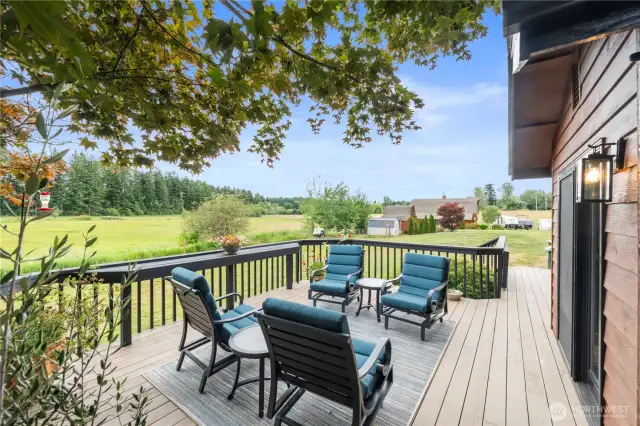 The expansive deck is the perfect spot to savor your morning coffee while watching the sunrise.