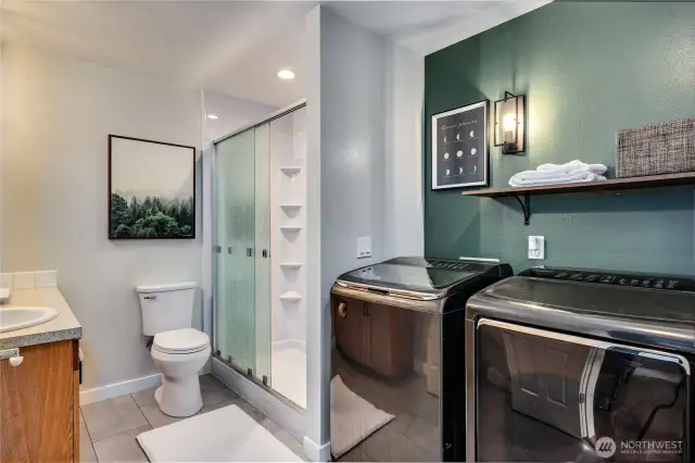 Full bath and laundry: remodeled with step-in shower, fresh paint and updated lighting.