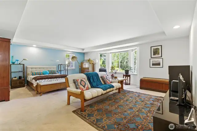 Primary bedroom with seating area