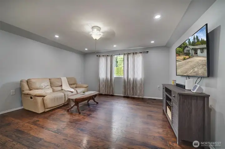 Open living room with recessed lighting.