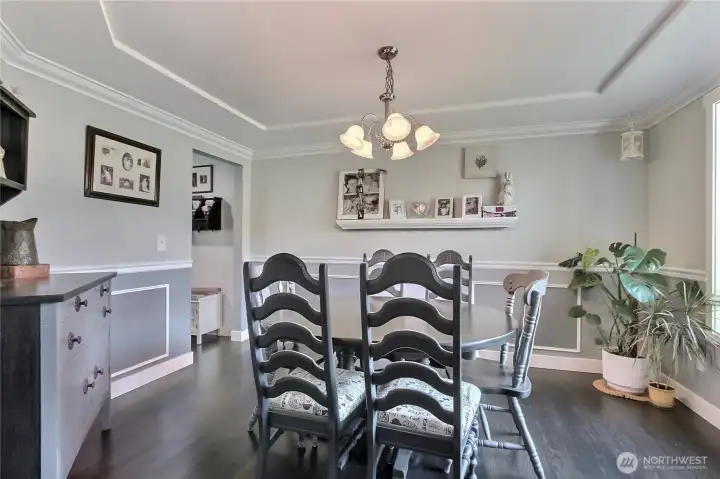 The dining room is designed with elegance in mind, featuring a beautifully crafted coved ceiling and sophisticated wains coating that enhances the overall ambiance and creates a truly refined space.