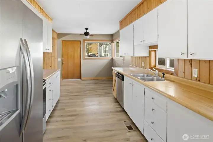 Front entry with lots of natural light into kitchen.