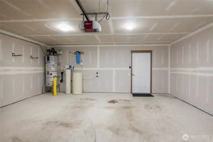 Large fully insulated two car garage, full house water softener and hot water tank.