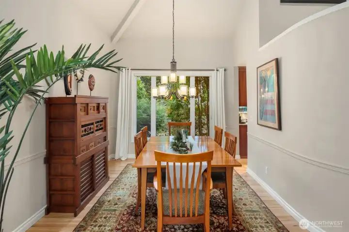 Formal dining room overlooks the professionally landscaped backyard.