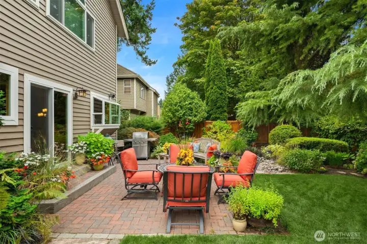 You'll love relaxing on the paver patio surrounded by the luscious garden. August 2025