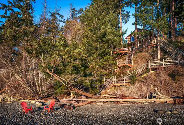 Beach house is nestled in the trees.