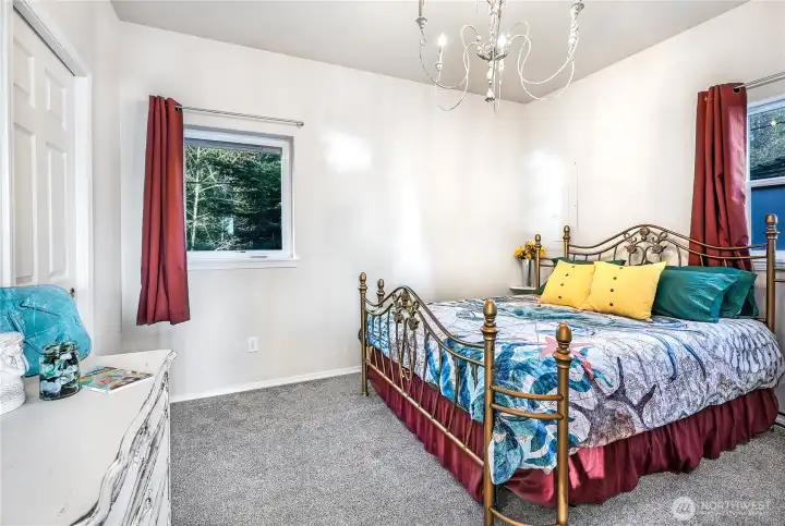 Main level primary suite located to the left of the entry