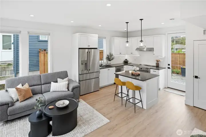 Enjoy indoor outdoor living with back door leading to a fully fenced yard with patio.