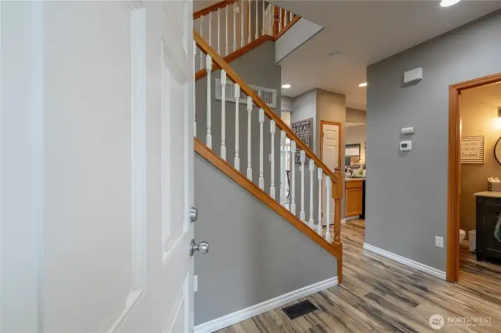 Step inside, and fall in love w/gorgeous floors, open banister staircase, and inviting energy.