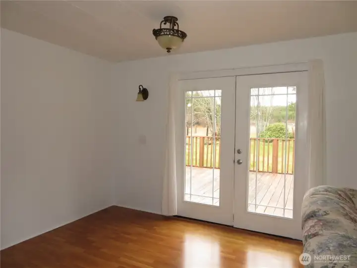 Frnech doors from the dining room out to the back deck.
