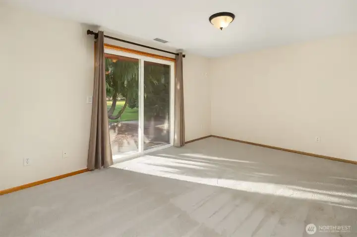 primary bedroom with slider door to back patio