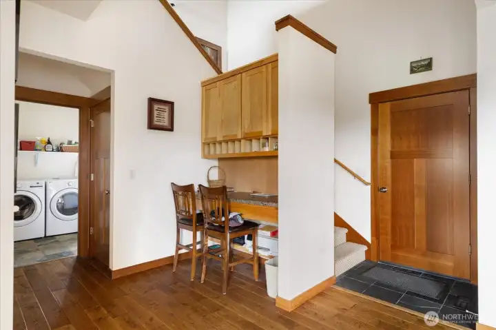 Built in secretary desk and cubby holes; staircase to loft - doors to garage and laundry