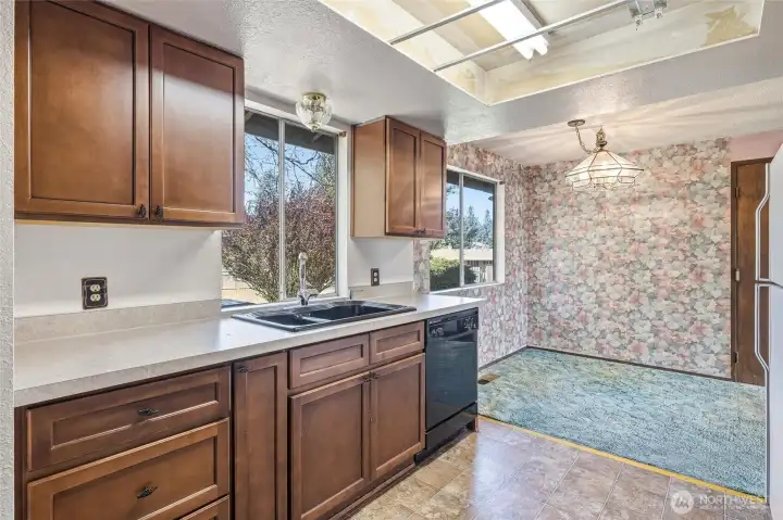 Kitchen open to dining area. Great views out back to private back yard and deck area.
