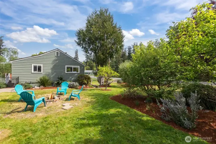Perfectly landscaped yard, fresh exterior paint, and newer roof with gutters just cleaned!
