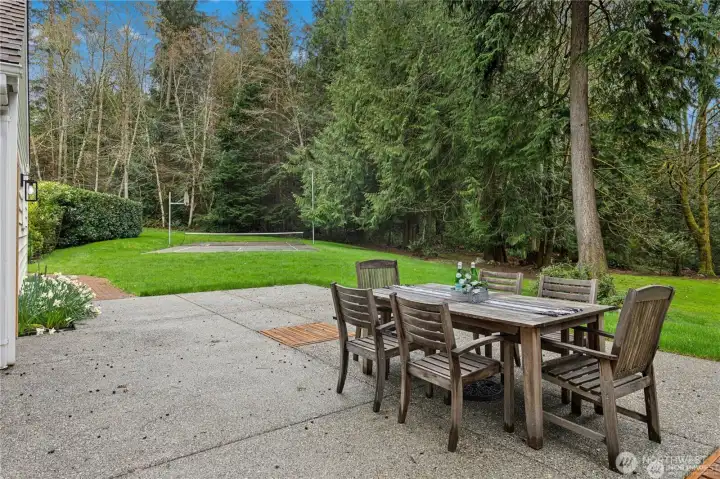 Large patio and personal Pickleball/ Sports Court in the background
