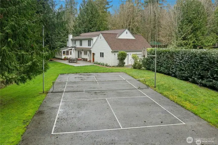 Private Lighted Pickleball Court with lush landscape all around