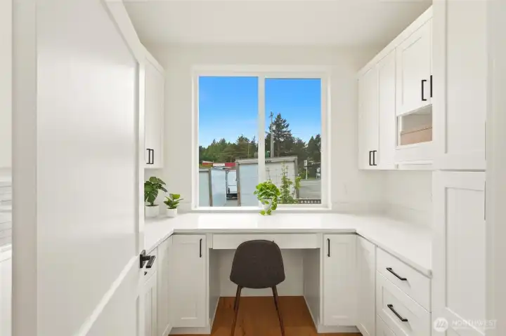 Butler's pantry with built-in desk and western exposure